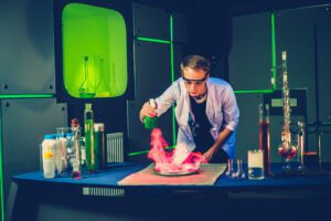 Young chemist making experiments in laboratory